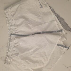 White Nike running shorts